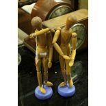 Two Wooden Articulated Figures on Stands, 33cms high