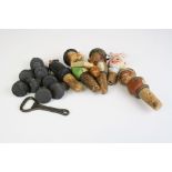 A collection of bottle stoppers and bottle openers to include carved wooden examples and Ushers of