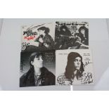 Music Autographs - Four signed Patti Smith 7" singles to include early German Piss In A River,