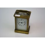 French 19th century brass case carriage clock with white enamel dial complete with key.