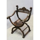 Gothic Revival Style Hardwood X Frame Chair, ornately carved with marks and foliage, 56cms wide x