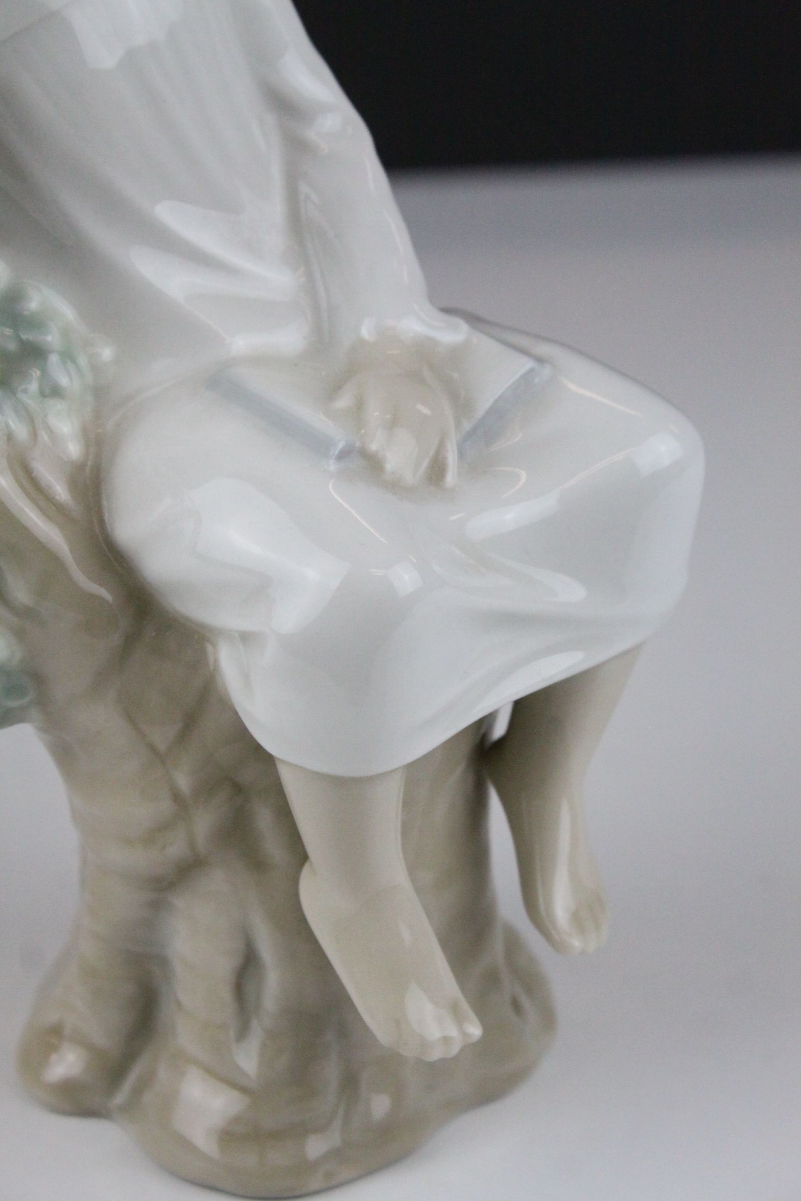 Two Lladro Figures - Boy with Book sat on a Tree, 21cms high and Baby sleeping on a Pillow, 10cms - Image 6 of 9