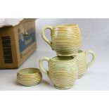 A group of Burton mid century pottery to include jugs , sugar bowl and mugs.