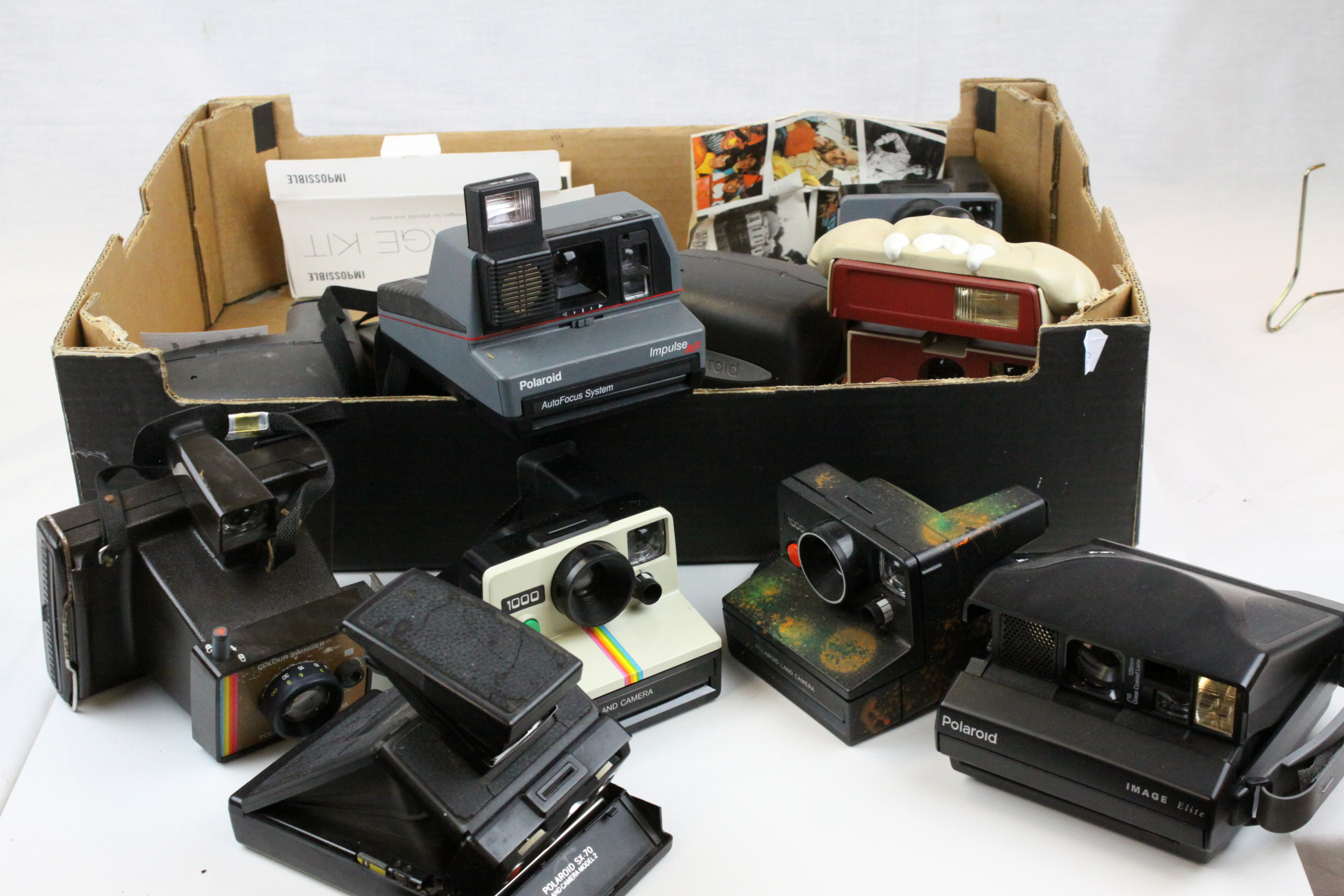 Collection of Polaroid Instant Cameras including 1000 Land Cameras, SX-70 Model 12, Impulse and