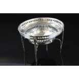 Early 20th century Asprey & Co silver bon bon dish, pierced body, raised on four tapered legs, cast