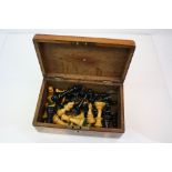 An antique weighted Jaques Style wooden chess set in oak box.