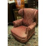 Late 19th / Early 20th century Wingback Armchair upholstered in Maroon Fabric