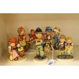 Five Goebel Hummel Figures including Easter Greeting, Doll Mother, Little Nurse Hansel merk dir 7