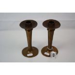 A pair of Arts & Crafts brass candlesticks