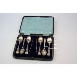 Cased set of six Edwardian silver Kings Pattern teaspoons with matching sugar tongs, makers James