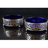 Pair of Edwardian Circular Pierced Silver Open Table Dishes with Blue Glass Liners, each raised on