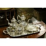 A silver plated oneida three piece teaset, and a two handled tray and bowl. different maker.