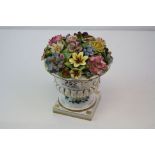 Chelsea Porcelain Flower Encrusted Urn with Gold Anchor mark to base, 15cms high