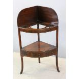 George III Mahogany Bow Fronted Corner Washstand, the under-tier shelf fitted with three drawers,