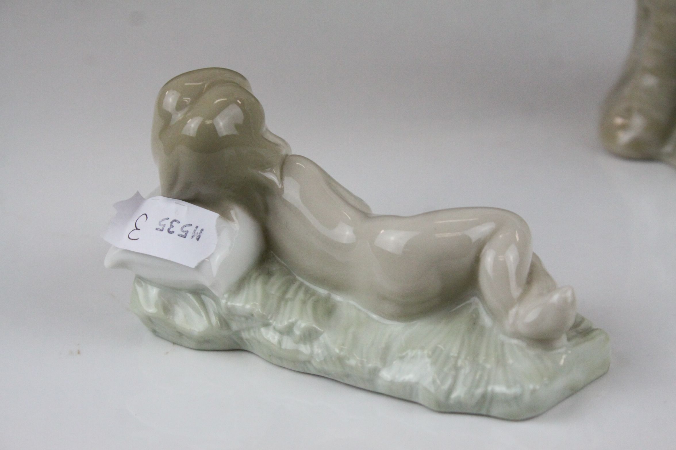 Two Lladro Figures - Boy with Book sat on a Tree, 21cms high and Baby sleeping on a Pillow, 10cms - Image 9 of 9