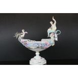 Continental Porcelain Boat Shaped Centrepiece Pedestal Bowl with dragon prow ridden by a cherub
