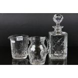 An Edinburgh crystal cut glass decanter and two similar jugs.