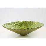 A large contemporary continental green art glass bowl of naturalistic form..