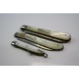 Two fully hallmarked sterling silver & mother of pearl folding fruit knives together with a