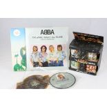 A set of boxed ABBA mugs two similar Lps and two singles Thank you for the music and A guetha