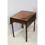George III Mahogany Pembroke Table raised on Chamfered Legs and Block Feet (some losses), 71cms wide