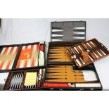 four contemporary Backgammon sets in travelling cases.
