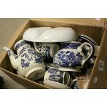 A large quantity of blue and white china to include willow pattern etc.