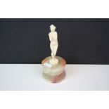 Art Deco ivory nude figurine on a polished onyx base.