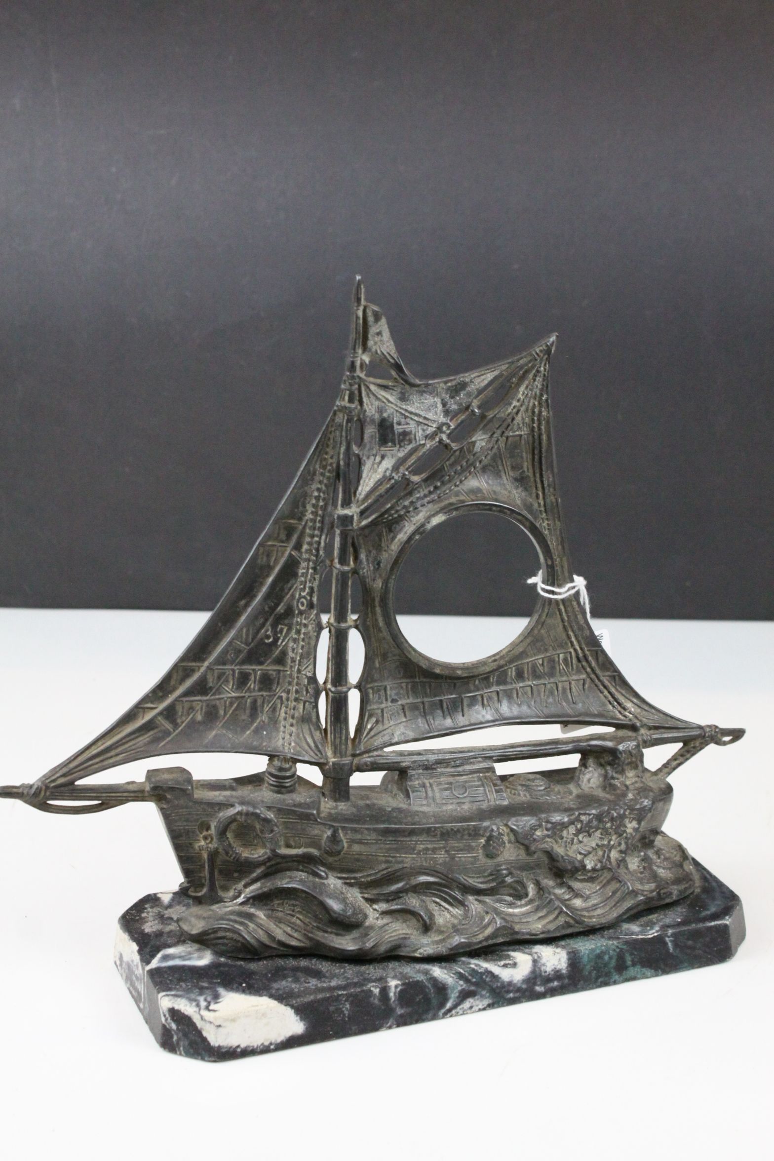 Art Deco Spelter Watch Holder in the form of a Sailing Boat on a Faux Marble Plinth, 26cms high