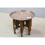 Small Asian Copper Engraved Table on Folding Wooden Base, 32cms diameter