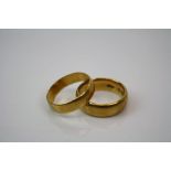 Two fully hallmarked 22ct gold wedding bands.