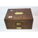 A Late 19th to early 20th century ladies fully fitted vanity box, finished in mahogany with brass