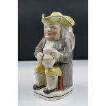 19th century Seated Toby Jug with Tricorn Hat Lid and holding a Jug of Ale, 26cms high