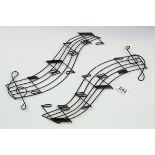 A pair of 20th century music note wall decorations.