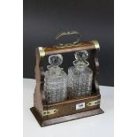 Late 19th / Early 20th century Oak Two Bottle Tantalus with Silver Plated Mounts (matching decanters