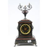 Victorian Slate and Marble Mantle Clock surmounted by an Urn Shaped Finial, raised on Metal Lion Paw