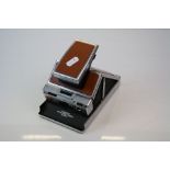 A vintage Polaroid SX-70 Land Camera Alpha 1.