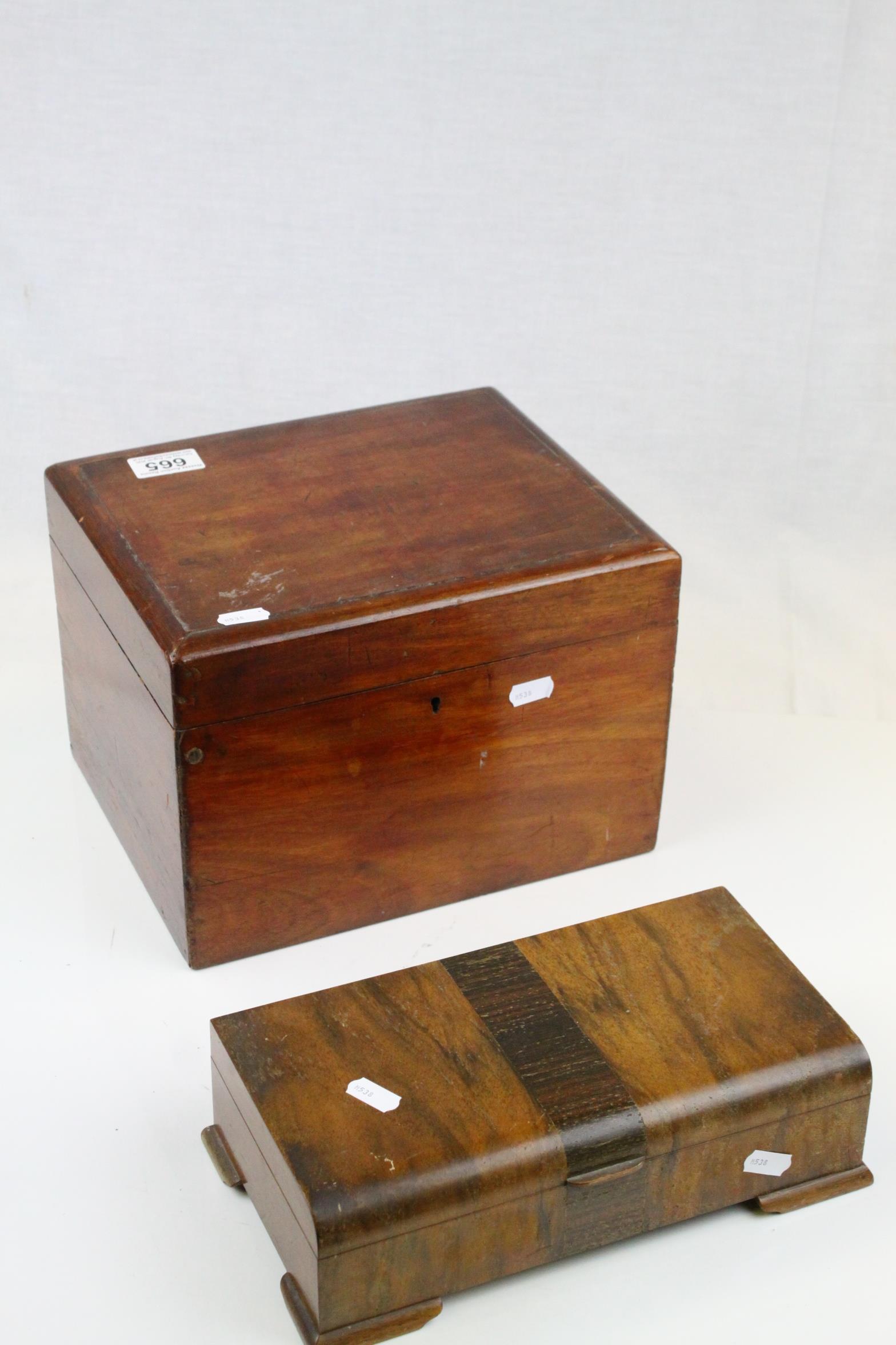 An antique mahogany box and a mid 20th century cigarette box.