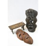 Two Tribal Hardwood Face Masks together with a Small Folding Stool with Flower decoration