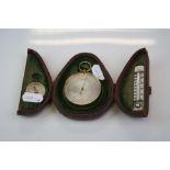 An early 20th century pocket Barometer, thermometer and compass set complete with original fitted