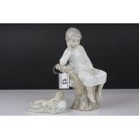 Two Lladro Figures - Boy with Book sat on a Tree, 21cms high and Baby sleeping on a Pillow, 10cms