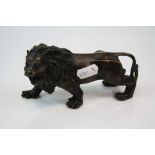 A brass/bronze figure of a lion