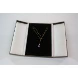 A fully hallmarked 9ct gold and amethyst pendant on a 9ct gold necklace.