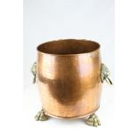 Large Copper Planter / Log Basket with Brass Lion Mask Ring Handles and raised on Three Brass Lion