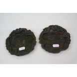A pair of Meiji period bronzed spelter pin dishes decorated with carp and dragons