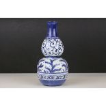 A blue and white double gourd vase with painted fern decoration