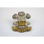 A Silver Gilt Officers Cap Badge To The Welsh Regiment With Twin Loop Fixings To The Rear.