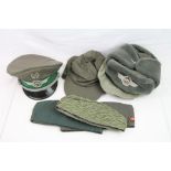 A Collection Of East German DDR Military Hats To Include Peak Caps And Forage Side Caps.