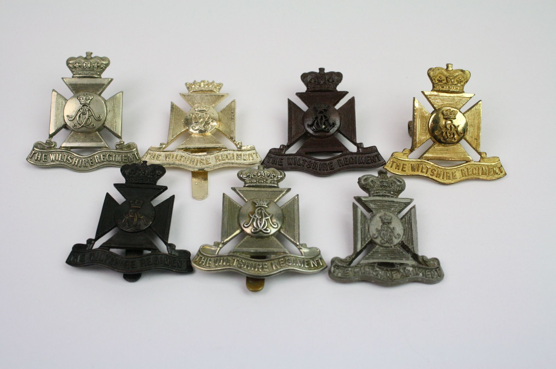 A Collection Of Seven The Wiltshire Regiment Cap Badges To Include A Bronzed, Brass, White Metal, - Image 2 of 14