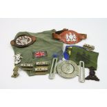 A Small Collection Of Military Badges And Belt Buckle.
